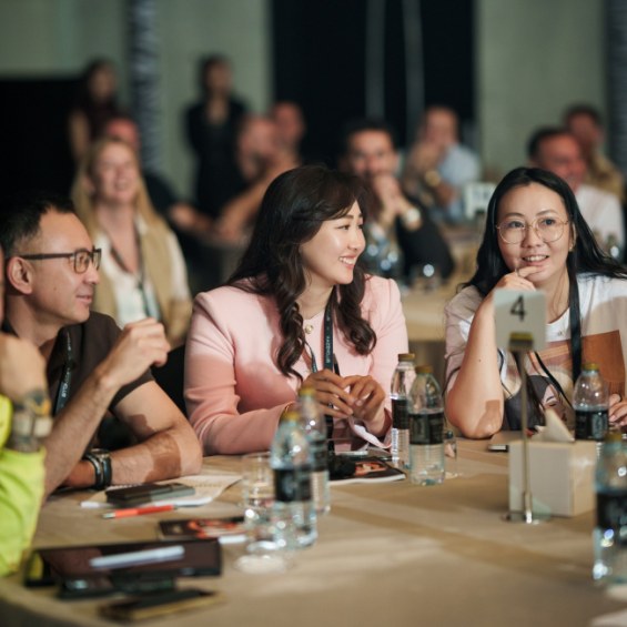 Corporate workshop participants engaged in group discussion | atravel.pro